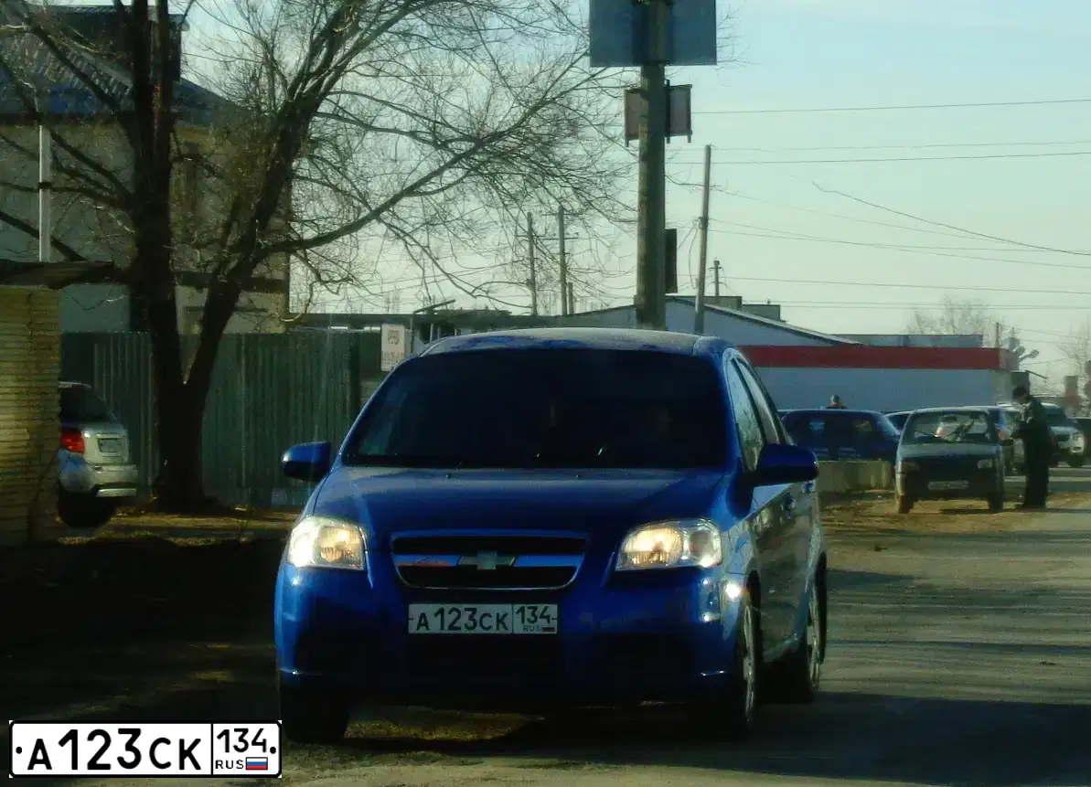 Фото автомобиля CHEVROLET AVEO, 2007 — госномер А123СК134. Цвет: СИНИЙ