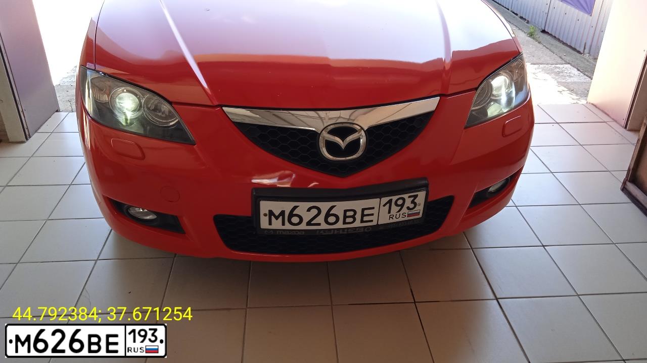 Фото автомобиля MAZDA 3, 2007 — госномер Е323АТ71. Цвет: Красный