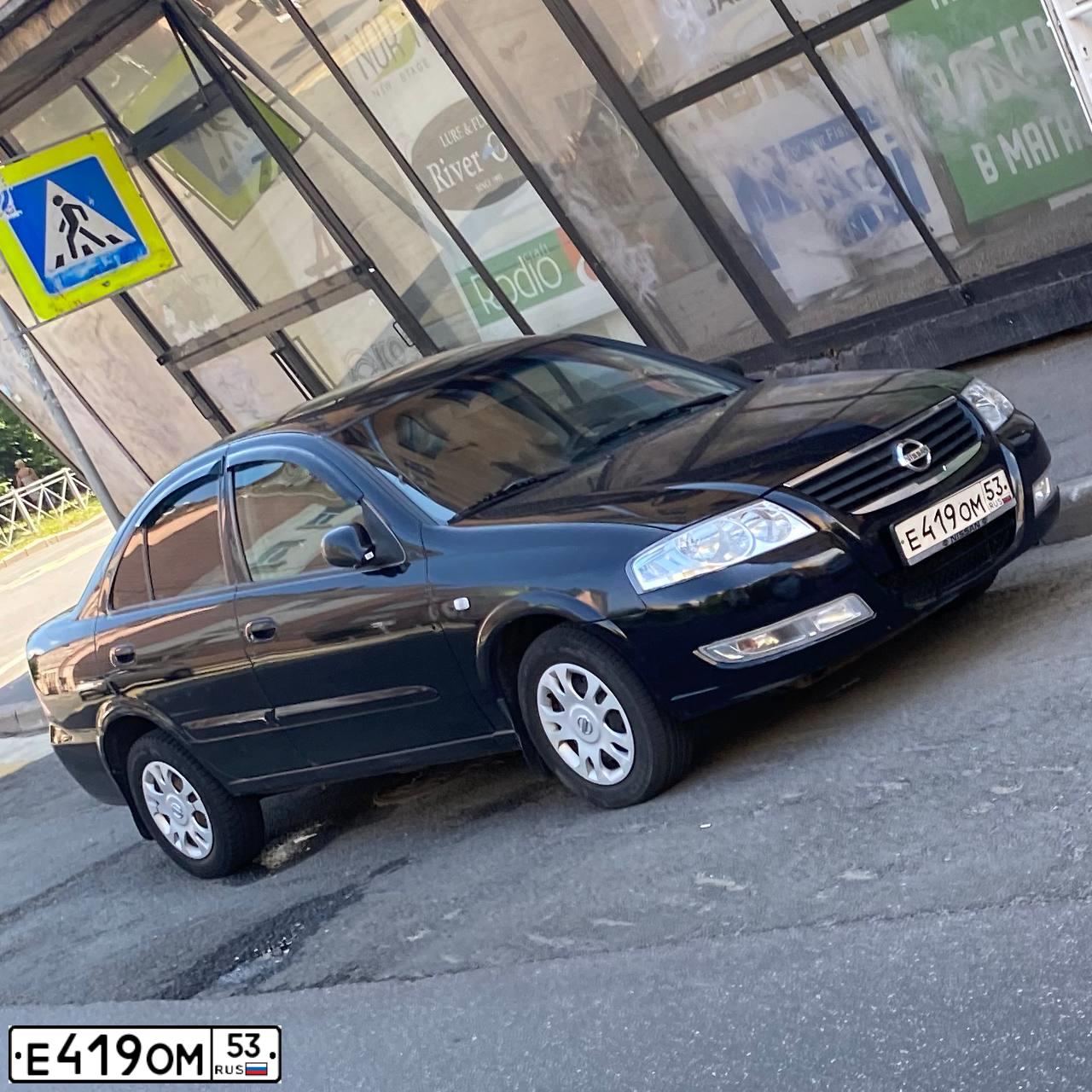 Фото автомобиля NISSAN ALMERA, 2007 — госномер Е419ОМ53. Цвет: ЧЕРНЫЙ