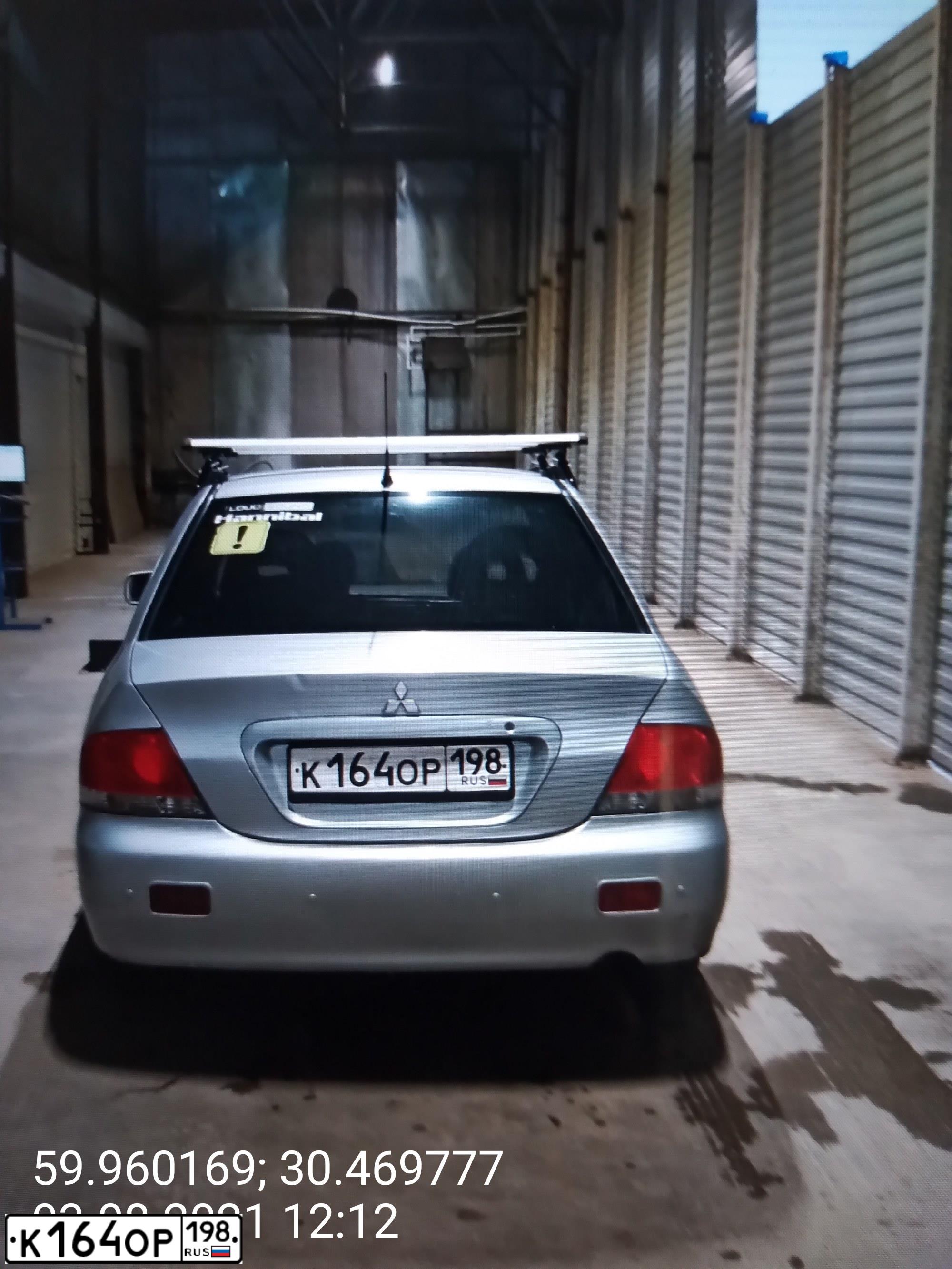 Фото автомобиля MITSUBISHI LANCER, 2006 — госномер К164ОР198. Цвет: Серебристый