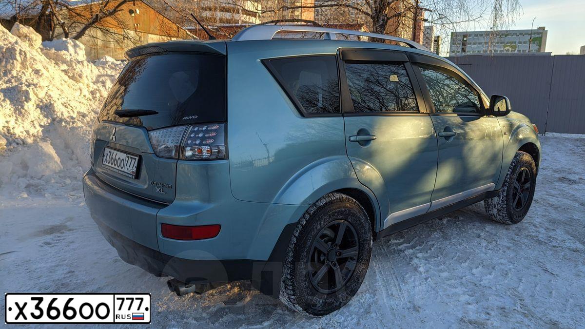 Фото автомобиля MITSUBISHI OUTLANDER, 2007 — госномер К923ОО77. Цвет: СЕРО-ГОЛУБОЙ