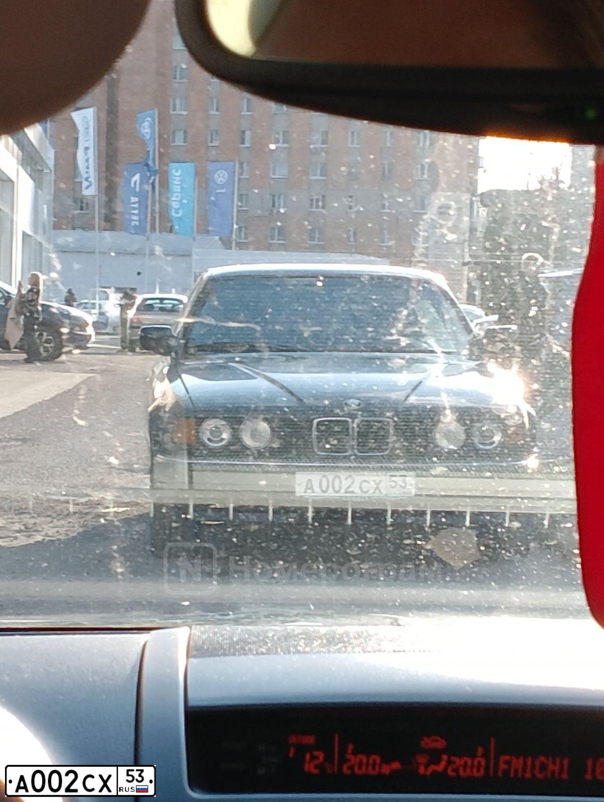 Фото автомобиля BMW SERIE 7, 1991 — госномер А002СХ53. Цвет: ЧЕРНЫЙ