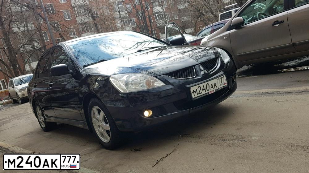 Фото автомобиля MITSUBISHI LANCER, 2005 — госномер А504ХХ199. Цвет: ЧЕРНЫЙ