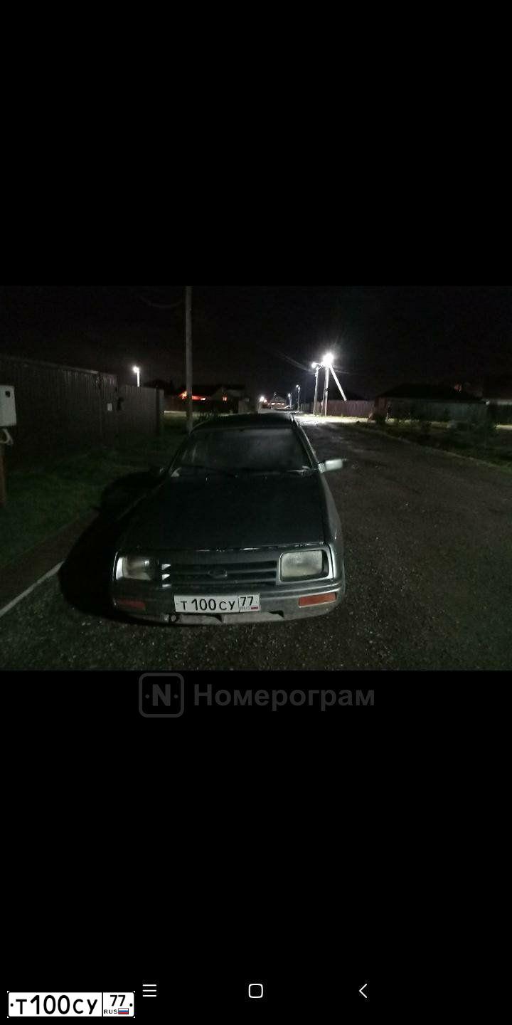 Фото автомобиля FORD SIERRA, 1984 — госномер Т100СУ77. Цвет: темно-серый
