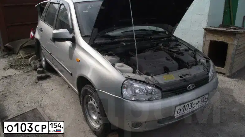 Фото автомобиля LADA 1117 KALINA, 2011 — госномер О103СР154. Цвет: СЕРЕБРИСТЫЙ