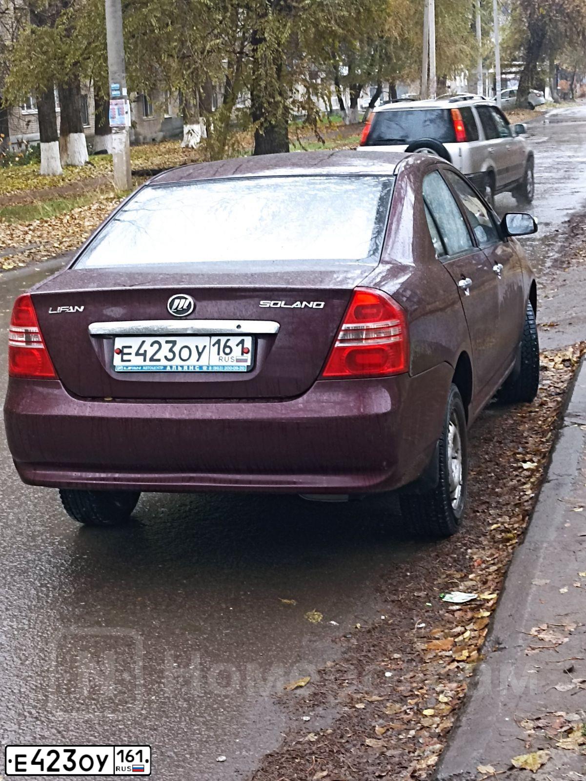 Фото автомобиля LIFAN SOLANO, 2012 — госномер Е423ОУ161. Цвет: ТЕМНО-ВИШНЕВЫЙ