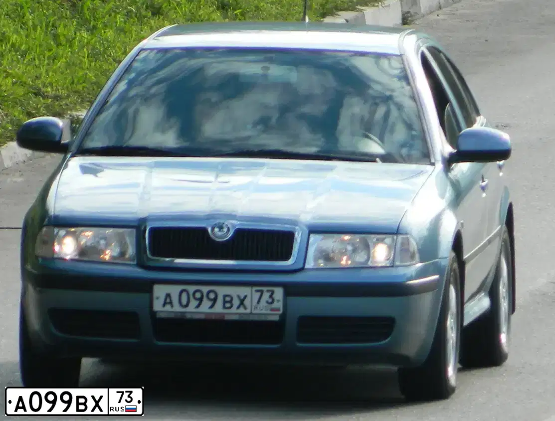 Фото автомобиля SKODA OCTAVIA, 2010 — госномер А099ВХ73. Цвет: СЕРО-ГОЛУБОЙ