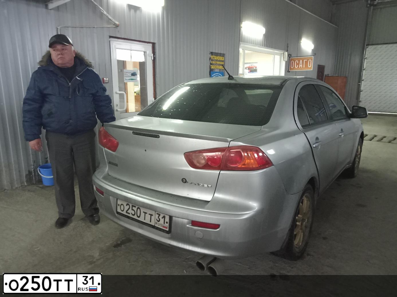 Фото автомобиля MITSUBISHI LANCER, 2008 — госномер О250ТТ31. Цвет: СЕРЫЙ