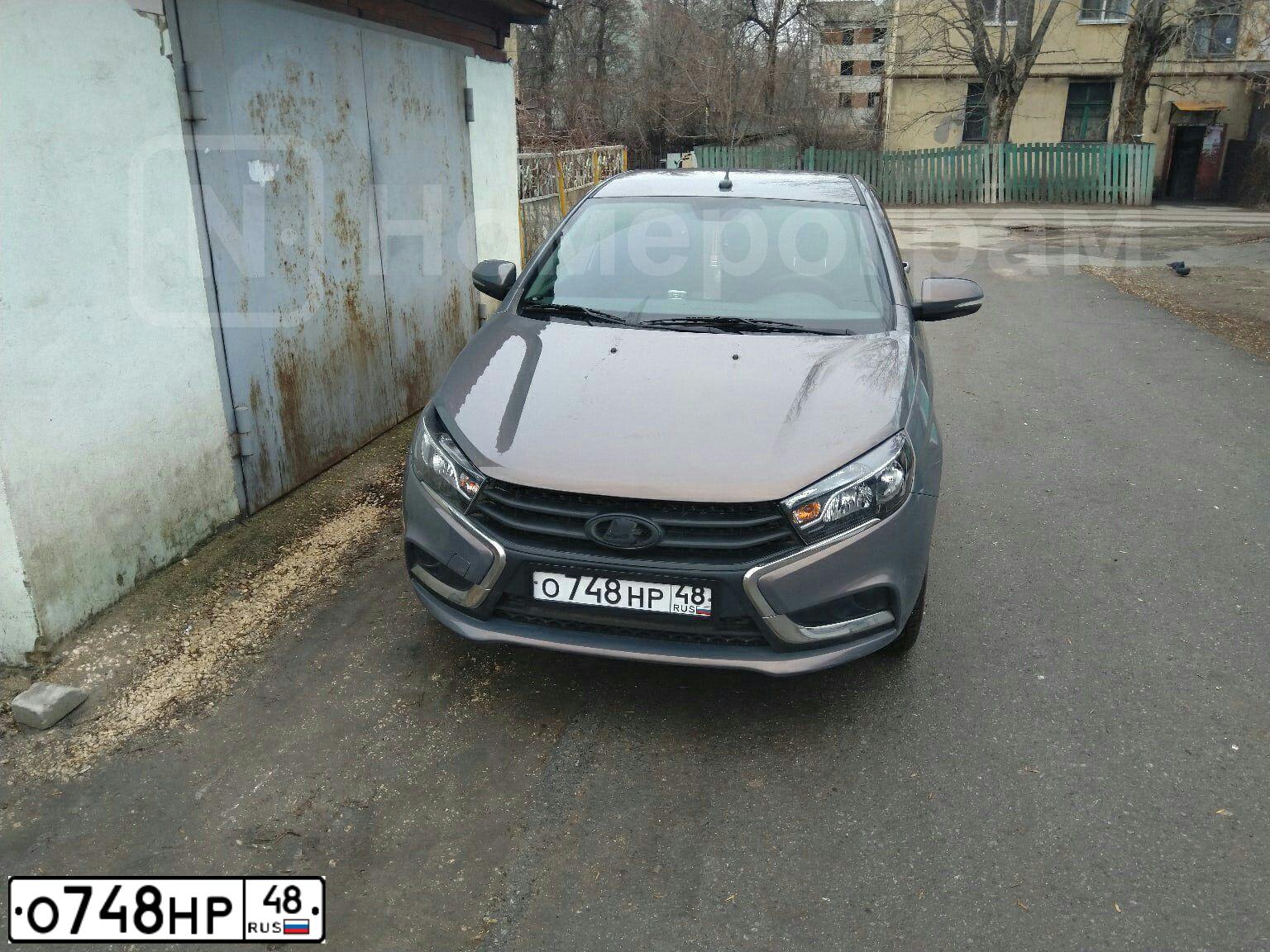 Фото автомобиля LADA VESTA, 2019 — госномер О748НР48. Цвет: СЕРЫЙ