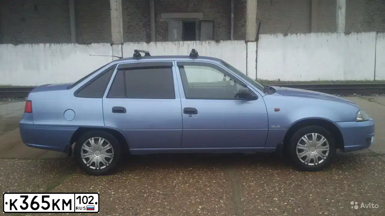 Фото автомобиля DAEWOO NEXIA, 2008 — госномер К365КМ102. Цвет: ПЕРЛАМУТРОВО-ГОЛУБОЙ