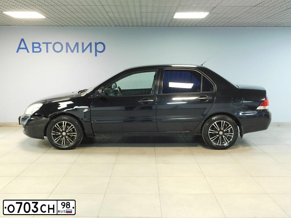 Фото автомобиля MITSUBISHI LANCER, 2009 — госномер Х195РЕ72. Цвет: ЧЕРНЫЙ