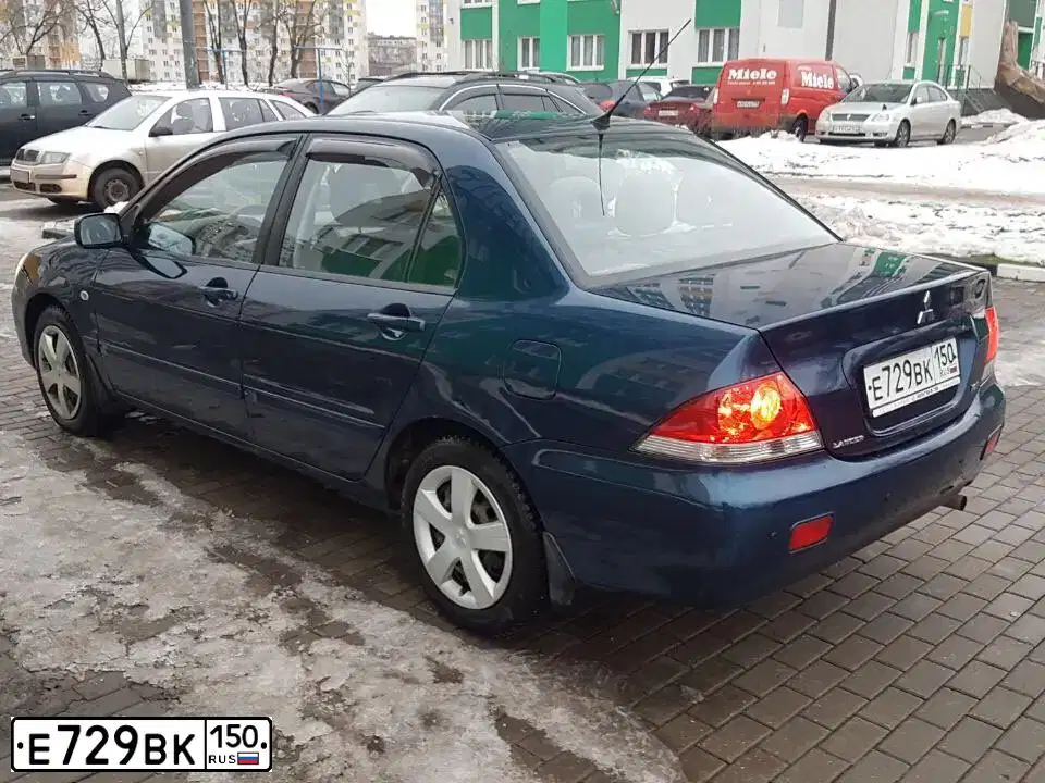 Фото автомобиля MITSUBISHI LANCER, 2004 — госномер Р936ЕА40. Цвет: синий
