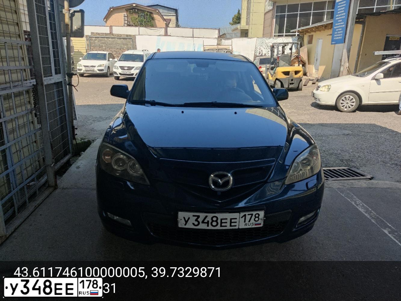 Фото автомобиля MAZDA 3, 2007 — госномер У348ЕЕ178. Цвет: сине-зеленый