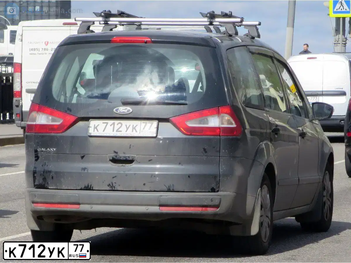 Фото автомобиля FORD GALAXY, 2009 — госномер К712УК77. Цвет: ЧЕРНЫЙ