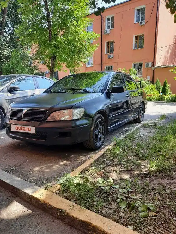 Фото автомобиля MITSUBISHI LANCER, 2002 — госномер О662РН196. Цвет: ЧЕРНЫЙ