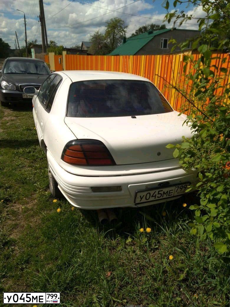 Фото автомобиля ПАНТИАК PONTIAC GRAND, 1993 — госномер Р203ЕС46. Цвет: СИНИЙ