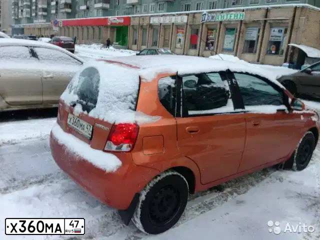 Фото автомобиля CHEVROLET AVEO, 2006 — госномер К902АМ147. Цвет: Оранжевый