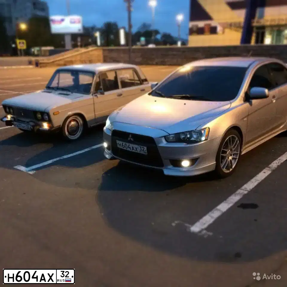 Фото автомобиля MITSUBISHI LANCER, 2008 — госномер М001МВ32. Цвет: СЕРЕБРИСТЫЙ