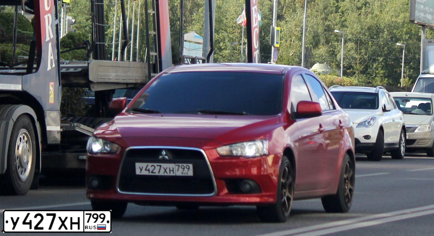 Фото автомобиля MITSUBISHI LANCER, 2011 — госномер М544НО152. Цвет: Красный