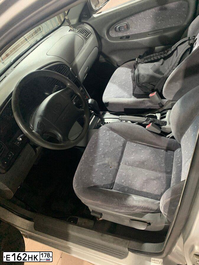 Фото автомобиля KIA SPECTRA, 2006 — госномер В167УУ122. Цвет: алмазное серебро (белый)