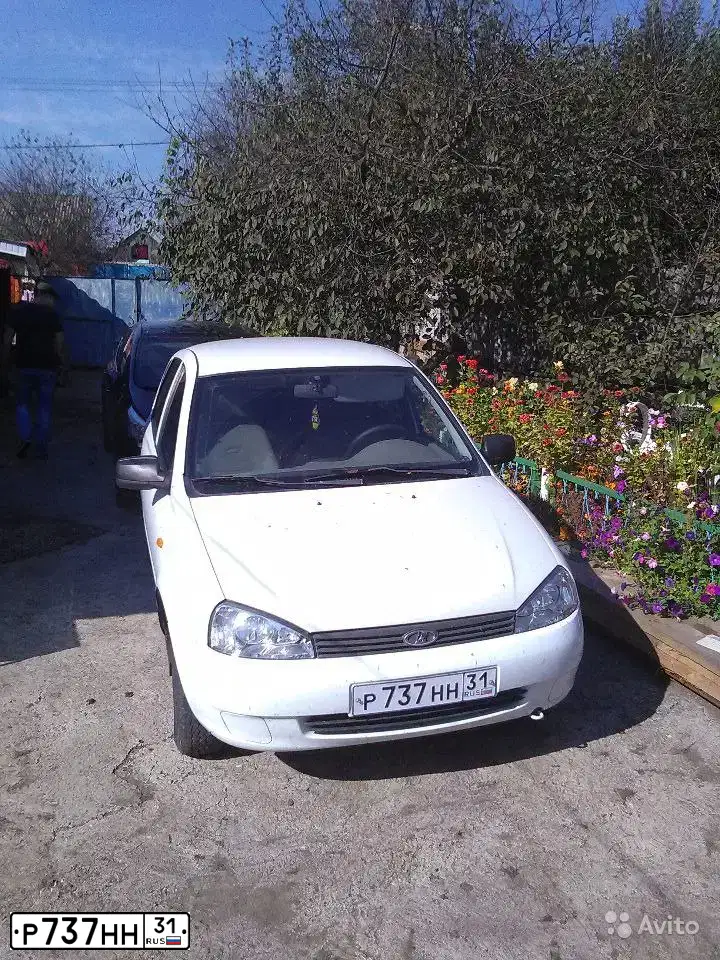 Фото автомобиля LADA 1119 KALINA, 2011 — госномер Р737НН31. Цвет: БЕЛЫЙ