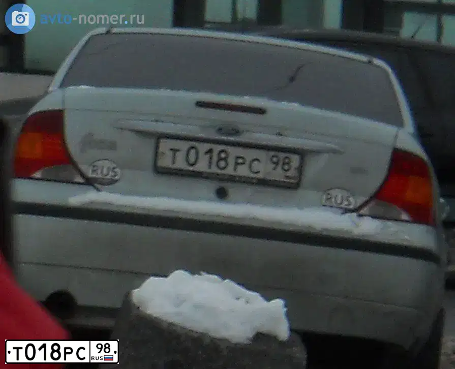 Фото автомобиля FORD FOCUS, 2004 — госномер Т018РС98. Цвет: СВЕТЛО-ЗЕЛЕНЫЙ