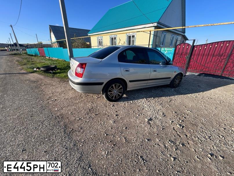 Фото автомобиля LADA 2190 GRANTA, 2012 — госномер Е445РН702. Цвет: Сине-Черный