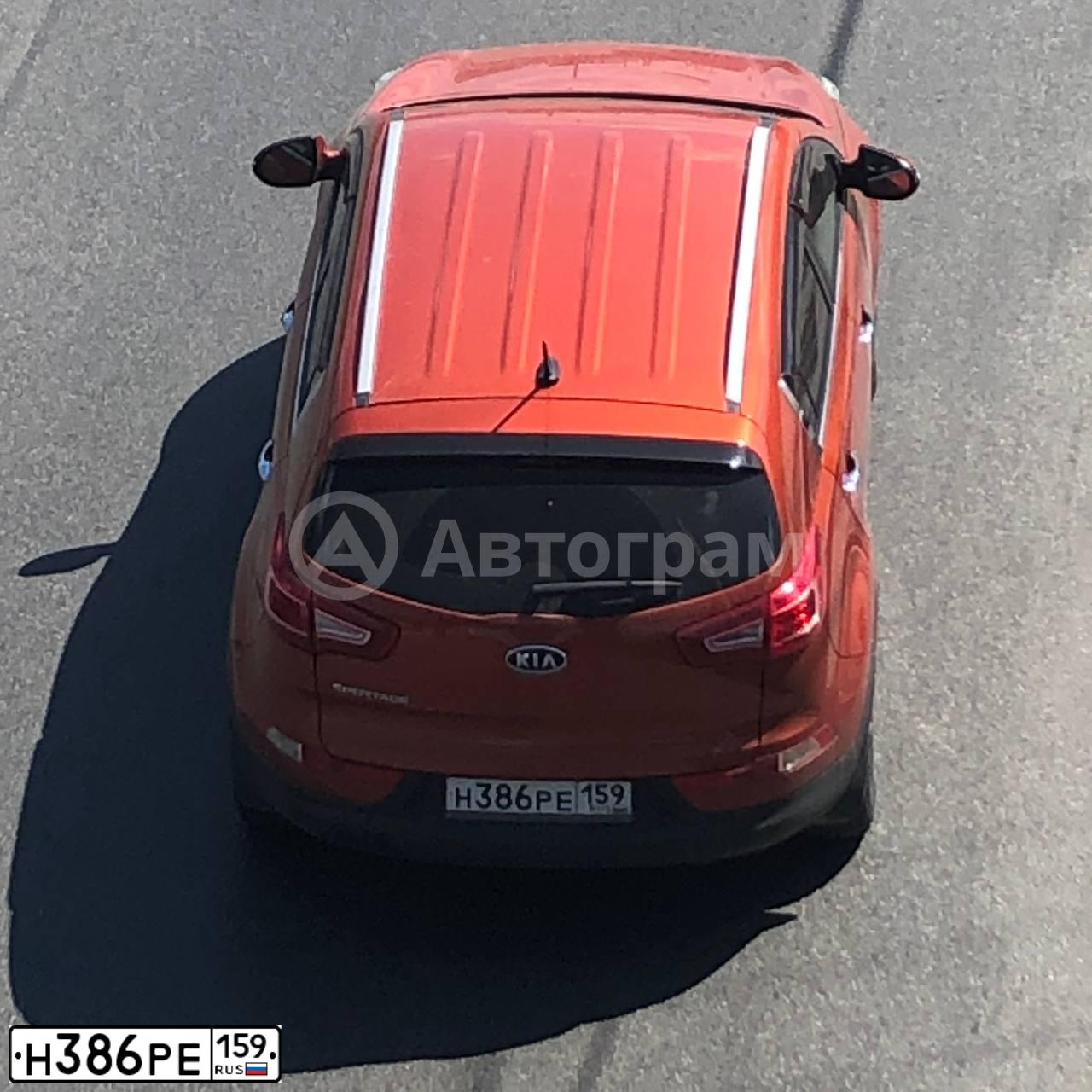 Фото автомобиля KIA SPORTAGE, 2012 — госномер Н386РЕ159. Цвет: Оранжевый