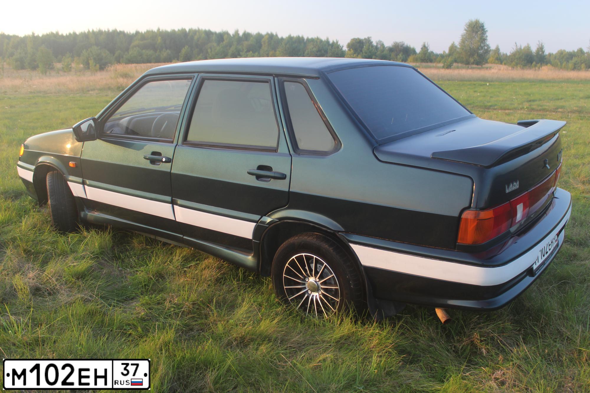 Фото автомобиля LADA 2115 SAMARA, 2007 — госномер М102ЕН37. Цвет: ТЕМНО-ЗЕЛЕНЫЙ