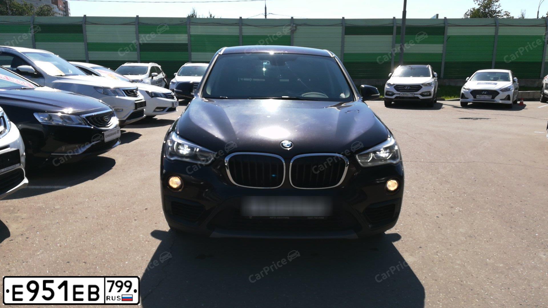 Фото автомобиля BMW X1, 2015 — госномер М606АТ35. Цвет: Коричневый