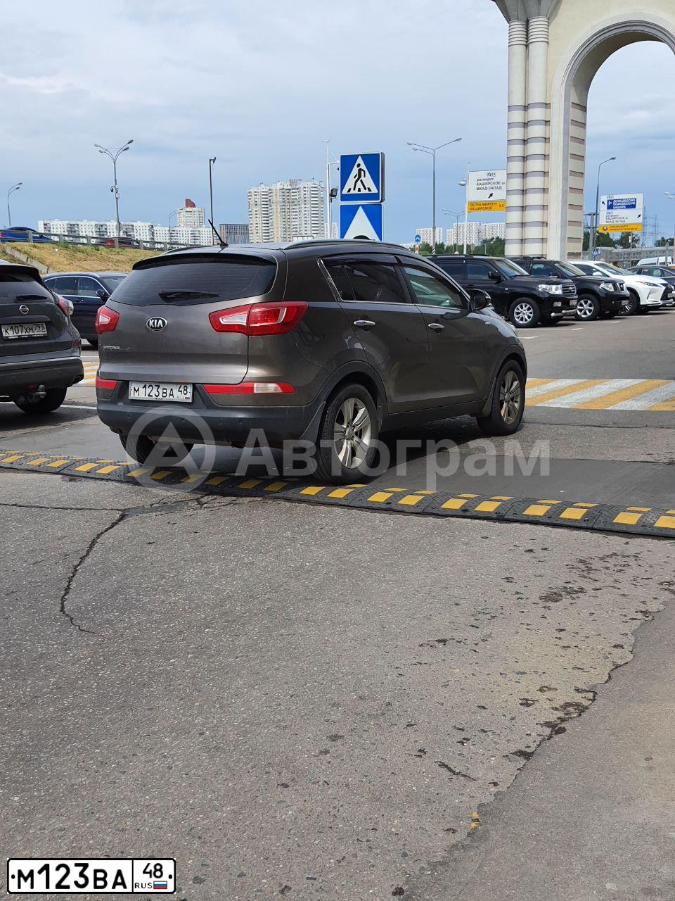 Фото автомобиля KIA SPORTAGE, 2013 — госномер М123ВА48. Цвет: Коричневый