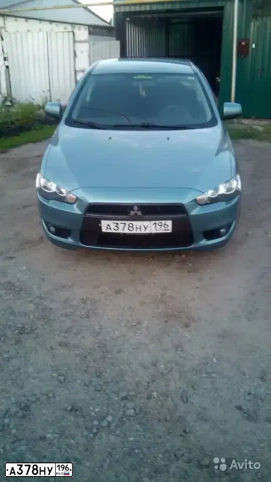 Фото автомобиля MITSUBISHI LANCER, 2007 — госномер О034ЕЕ774. Цвет: СВЕТЛО-СЕРО-ЗЕЛЕНЫЙ