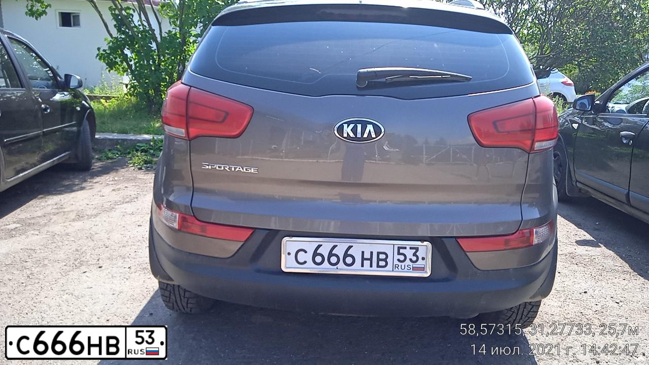 Фото автомобиля KIA SPORTAGE, 2014 — госномер К930МС53. Цвет: КОРИЧНЕВЫЙ