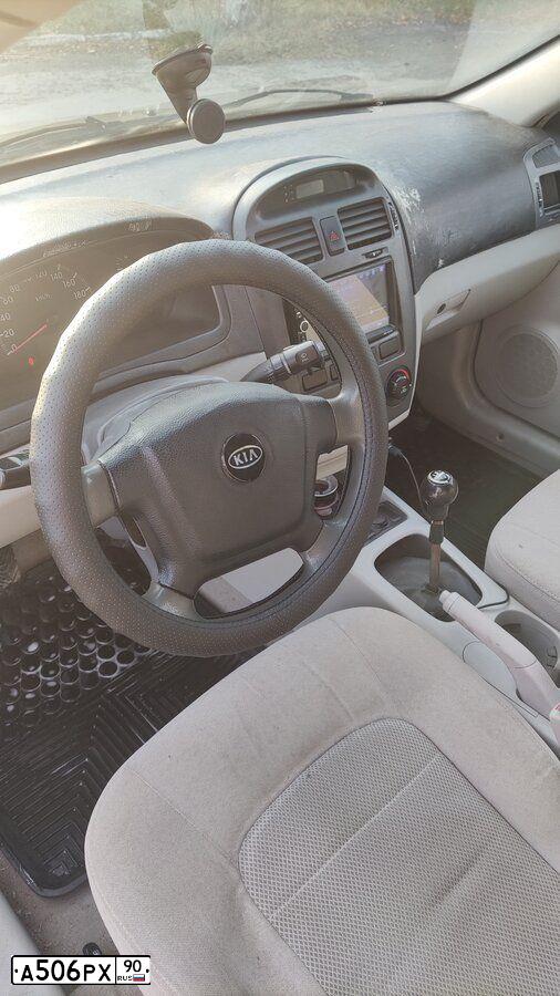 Фото автомобиля KIA CERATO, 2004 — госномер Н973ЕХ82. Цвет: БЕЖЕВЫЙ