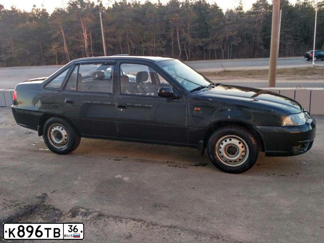 Фото автомобиля DAEWOO NEXIA, 2010 — госномер В828ВУ136. Цвет: Бледно-Черный