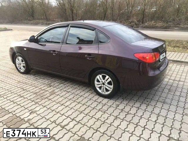Фото автомобиля HYUNDAI ELANTRA, 2009 — госномер К024ОК53. Цвет: ВИШНЕВЫЙ
