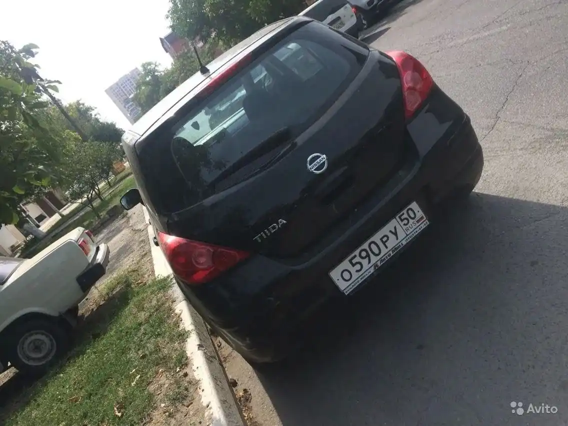 Фото автомобиля NISSAN TIIDA, 2012 — госномер К242ВК156. Цвет: ЧЕРНЫЙ