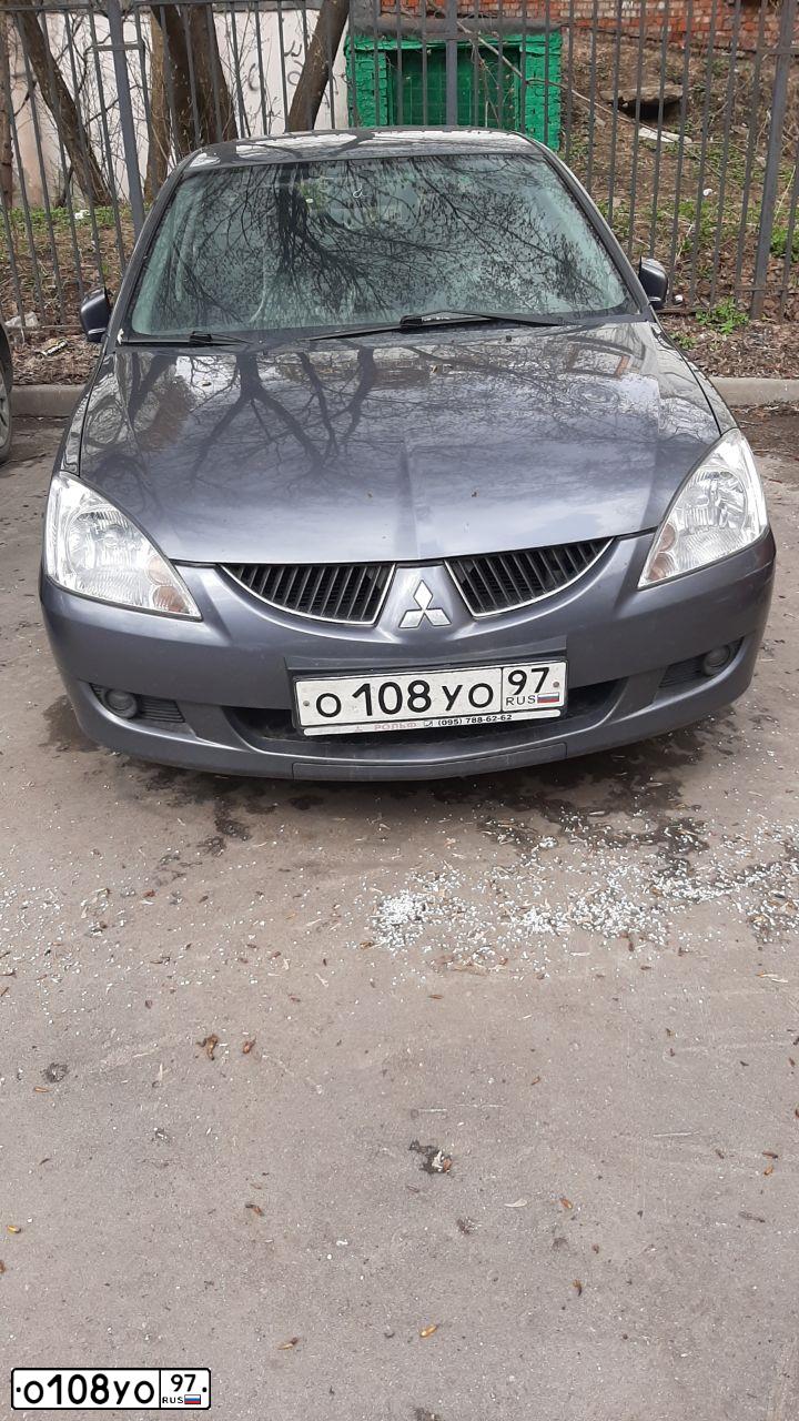 Фото автомобиля MITSUBISHI LANCER, 2005 — госномер О108УО97. Цвет: Серый