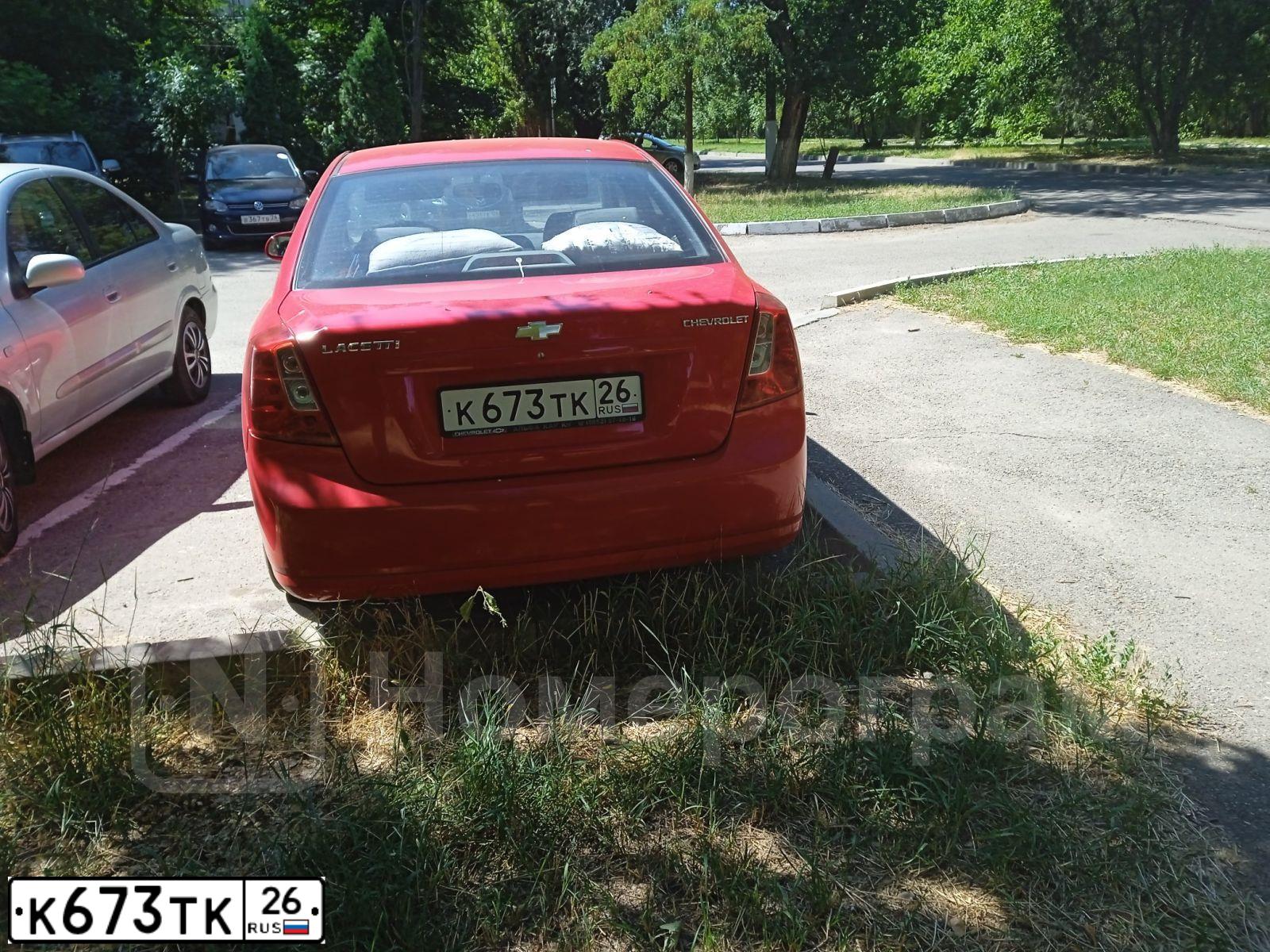 Фото автомобиля CHEVROLET LACETTI, 2008 — госномер К623ТК26. Цвет: КРАСНЫЙ