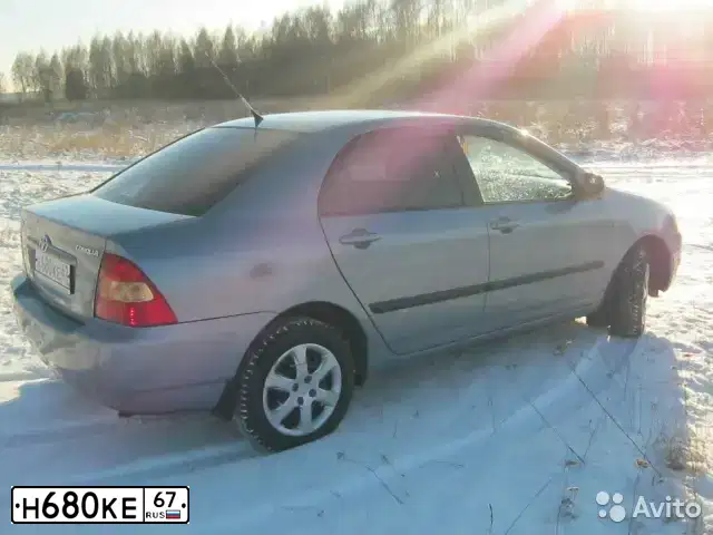 Фото автомобиля TOYOTA COROLLA, 2003 — госномер Н680КЕ67. Цвет: СЕРО-ГОЛУБОЙ