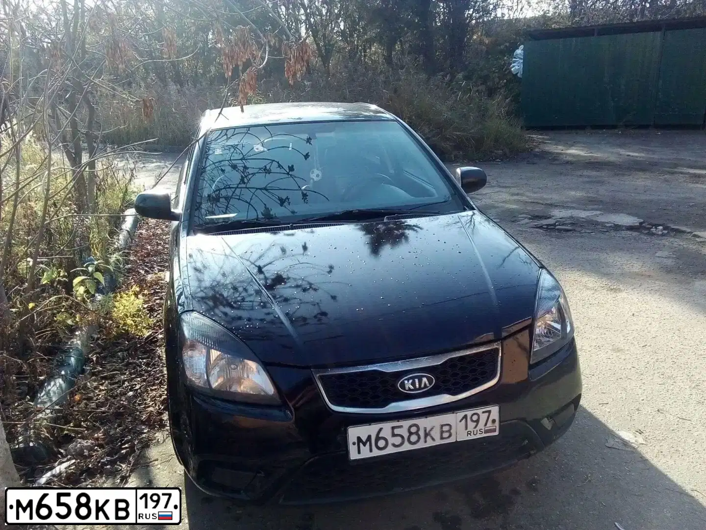 Фото автомобиля KIA RIO, 2009 — госномер М577АО761. Цвет: ЧЕРНЫЙ