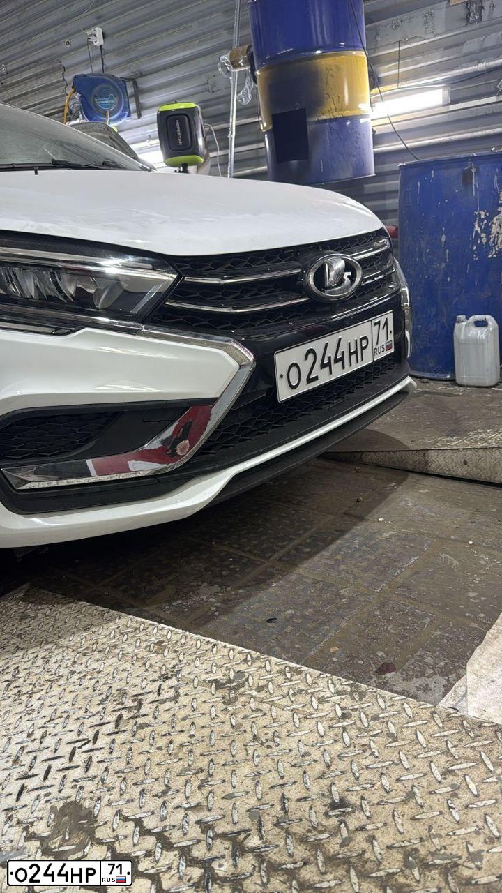 Фото автомобиля VAZ LADA VESTA GFК210, 2023 — госномер О244НР71. Цвет: Белый