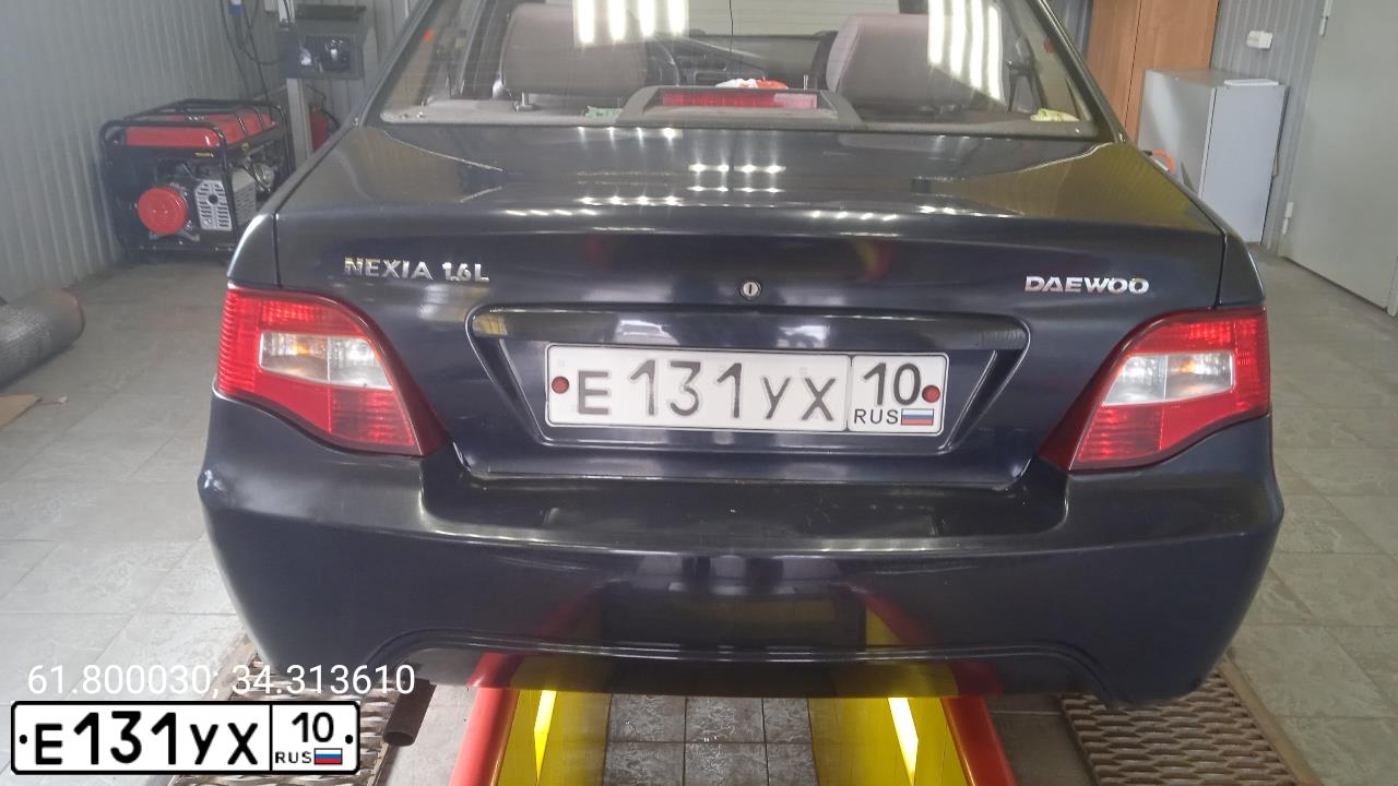 Фото автомобиля DAEWOO NEXIA, 2008 — госномер Е131УХ10. Цвет: Темно-синий