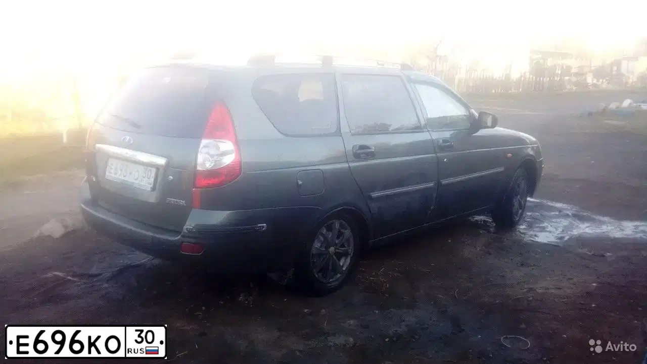 Фото автомобиля MITSUBISHI PAJERO SPORT, 2011 — госномер Е696КО30. Цвет: Коричневый