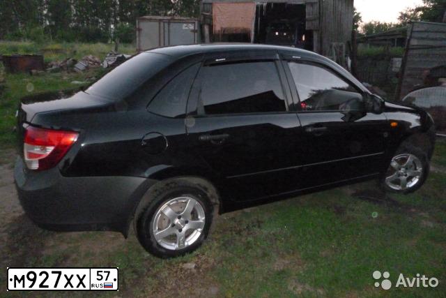 Фото автомобиля LADA 2190 GRANTA, 2012 — госномер К323ЕЕ136. Цвет: Сине-Черный