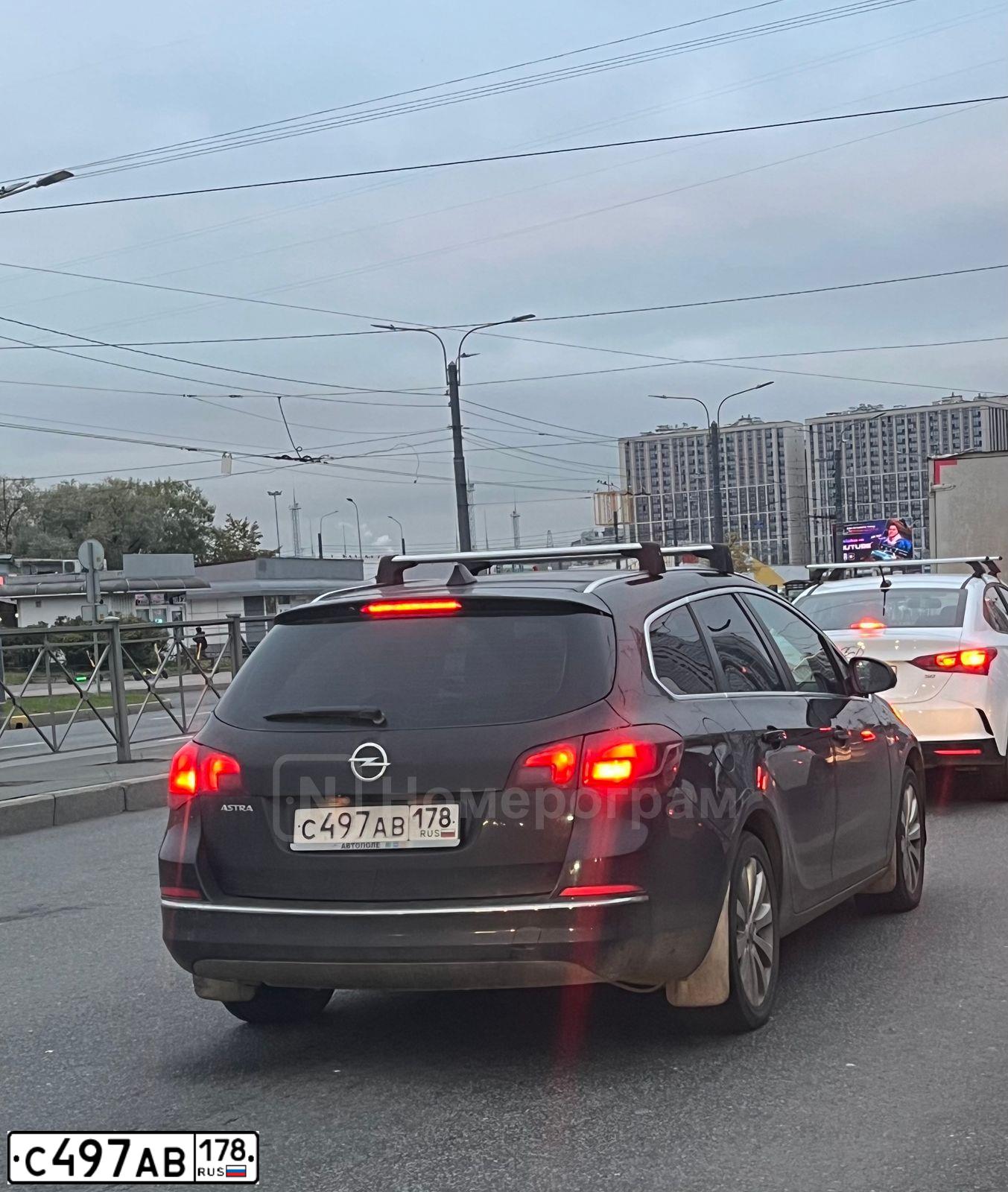 Фото автомобиля OPEL ASTRA, 2014 — госномер С497АВ178. Цвет: КОРИЧНЕВЫЙ