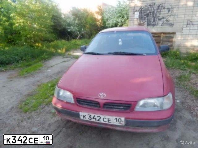 Фото автомобиля TOYOTA CARINA, 1994 — госномер А777УЕ10. Цвет: КРАСНЫЙ