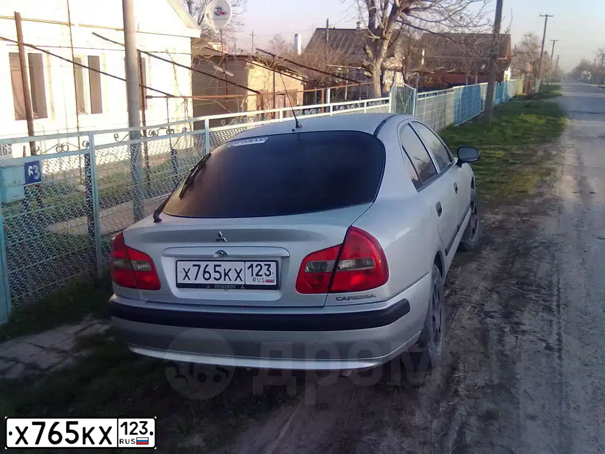 Фото автомобиля MITSUBISHI CARISMA, 2003 — госномер Н158АХ126. Цвет: Серебристый