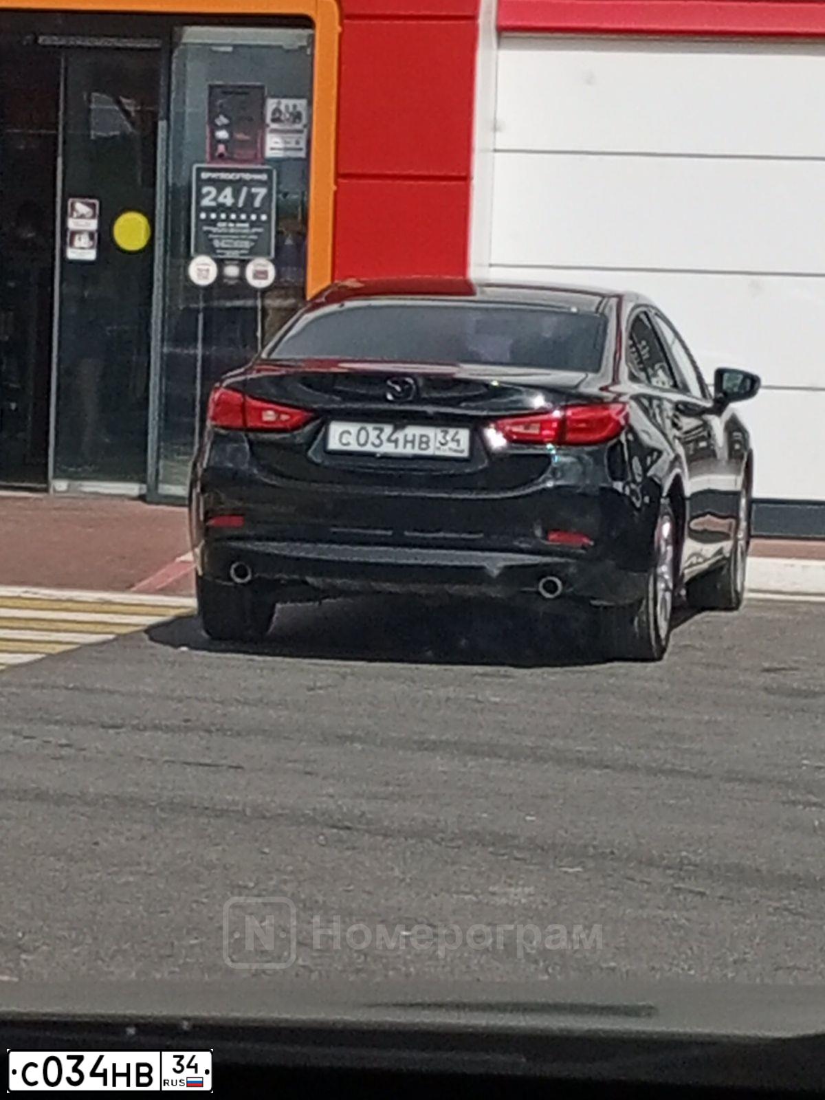 Фото автомобиля KIA SPECTRA, 2008 — госномер Н081РУ134. Цвет: Черный жемчуг (Чёрный)