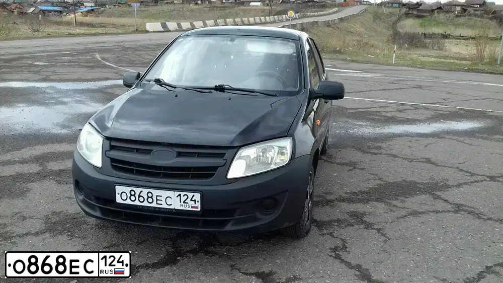Фото автомобиля LADA 2190 GRANTA, 2012 — госномер О868ЕС124. Цвет: СИНЕ-ЧЕРНЫЙ